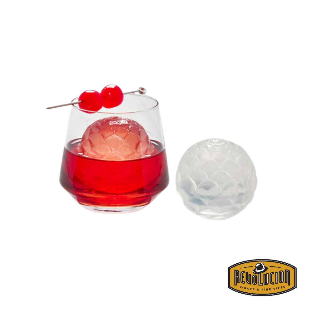 Petal-shaped cocktail ice floating in a vibrant red drink, adding a stylish touch to the beverage.
