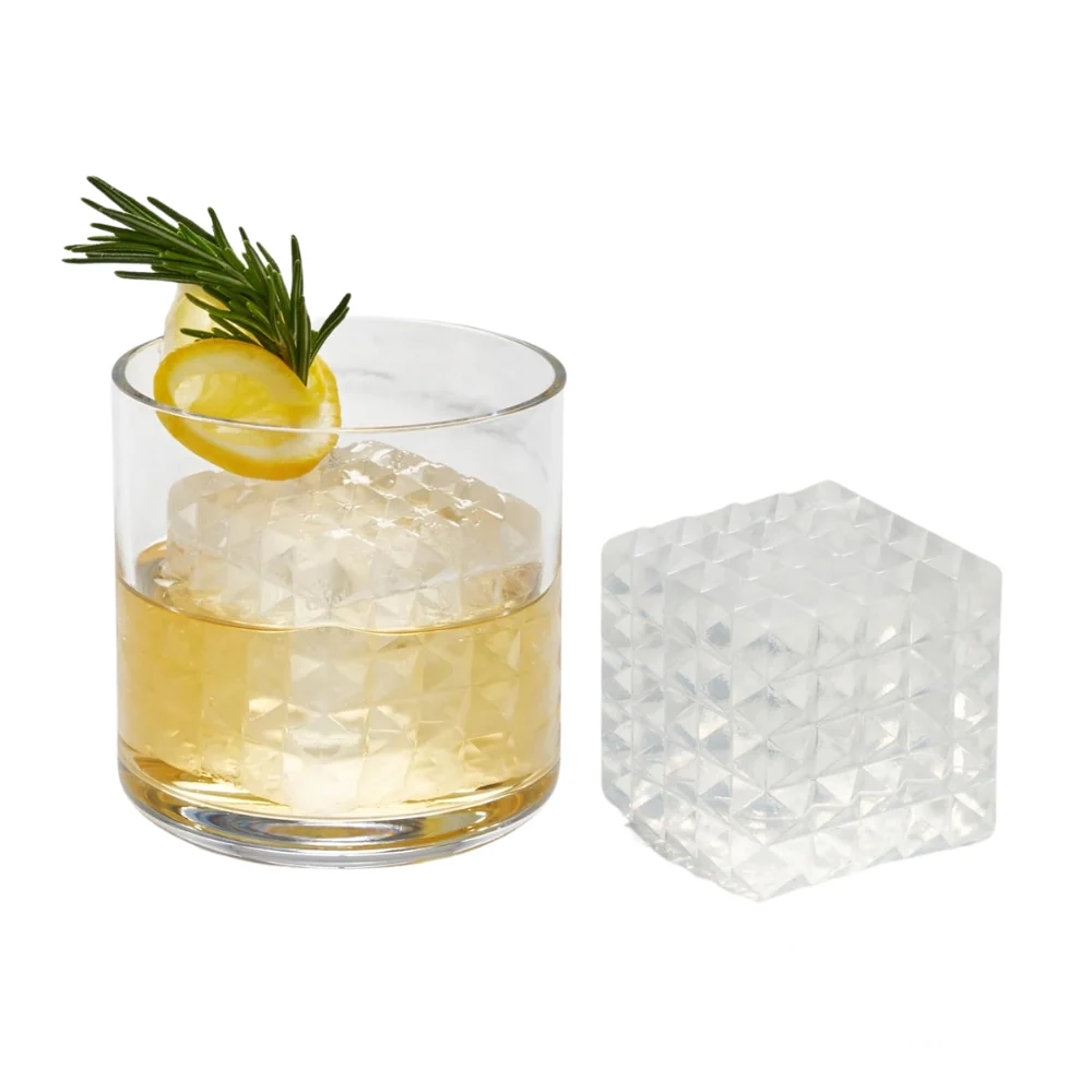 Refreshing lemon cocktail showcasing a striking prism-shaped ice cube made with the W&P tray.