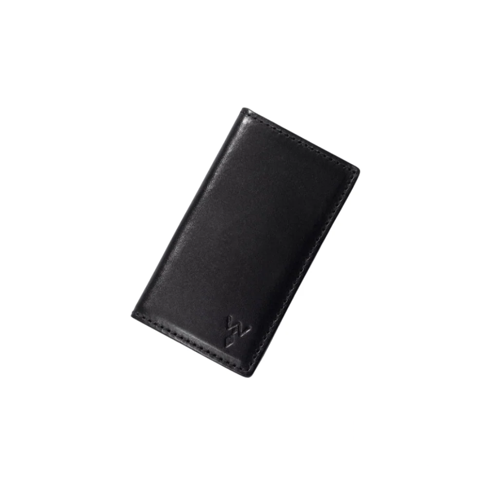 Black leather Wurkin Stiffs Power Stay Wallet in a sleek, closed front view, designed for organizing collar stays with style.