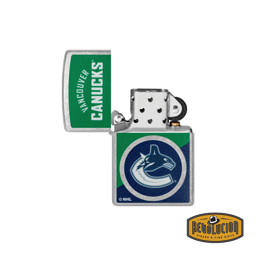 A Zippo lighter featuring the Vancouver Canucks logo and team colors, displayed in an open position, revealing the classic windproof insert.
