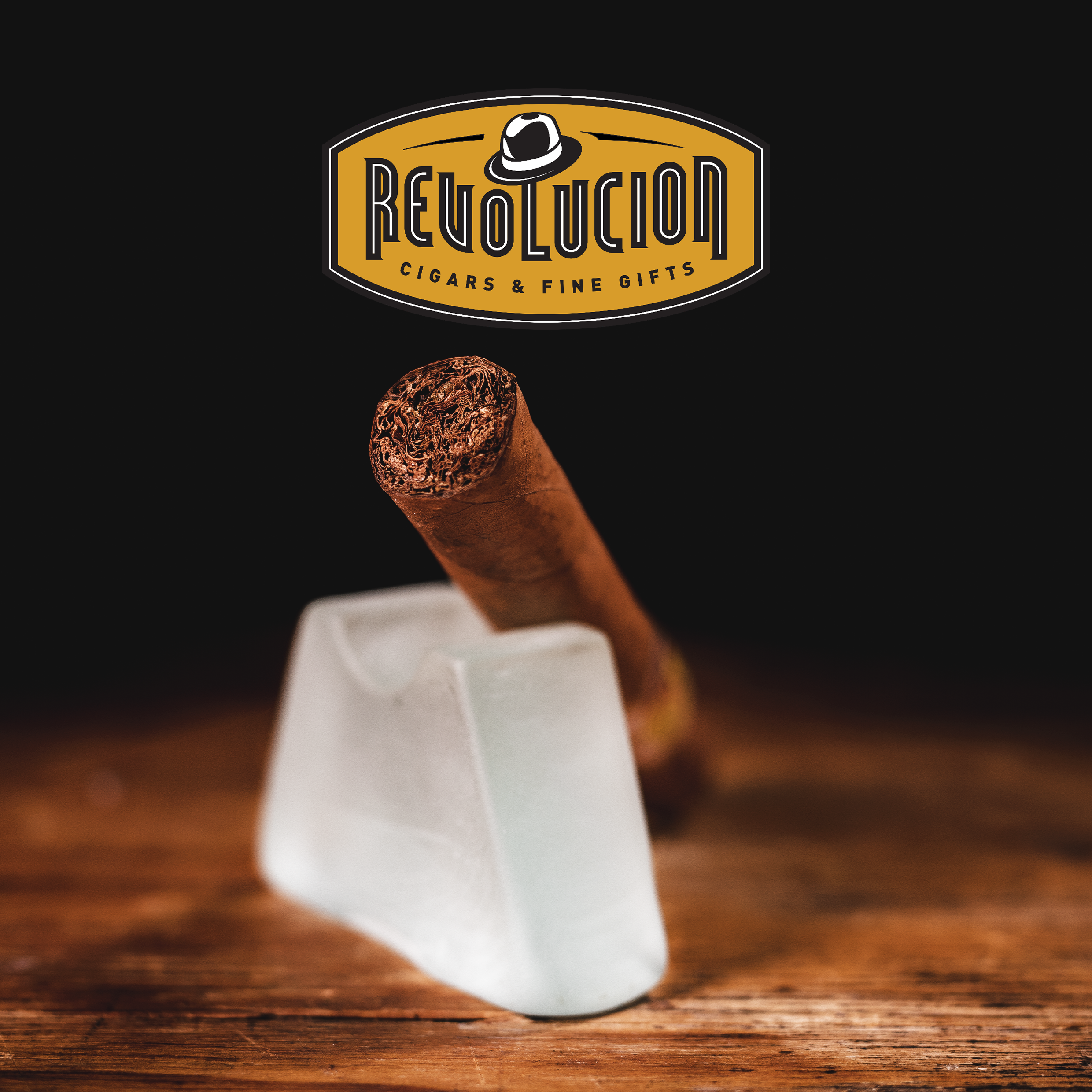 Bolivar Royal Corona Cuban cigar resting on a sleek cigar stand, showcasing its foot and rich brown wrapper.