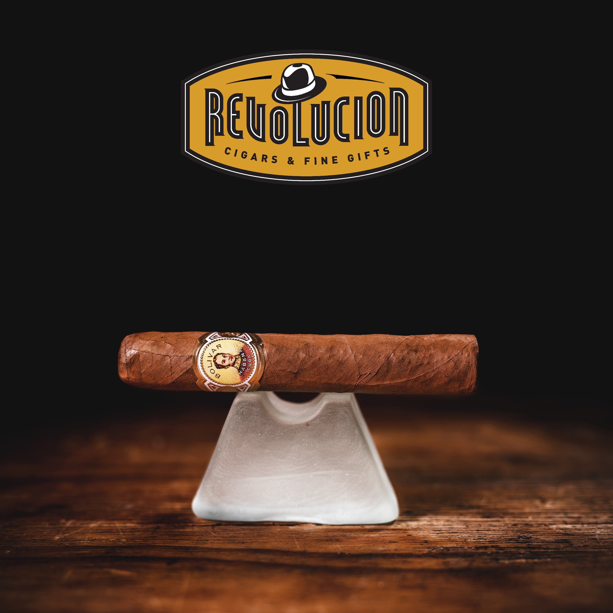 Bolivar Royal Corona Cuban cigar resting on a sleek cigar stand, showcasing its rich brown wrapper and signature band.