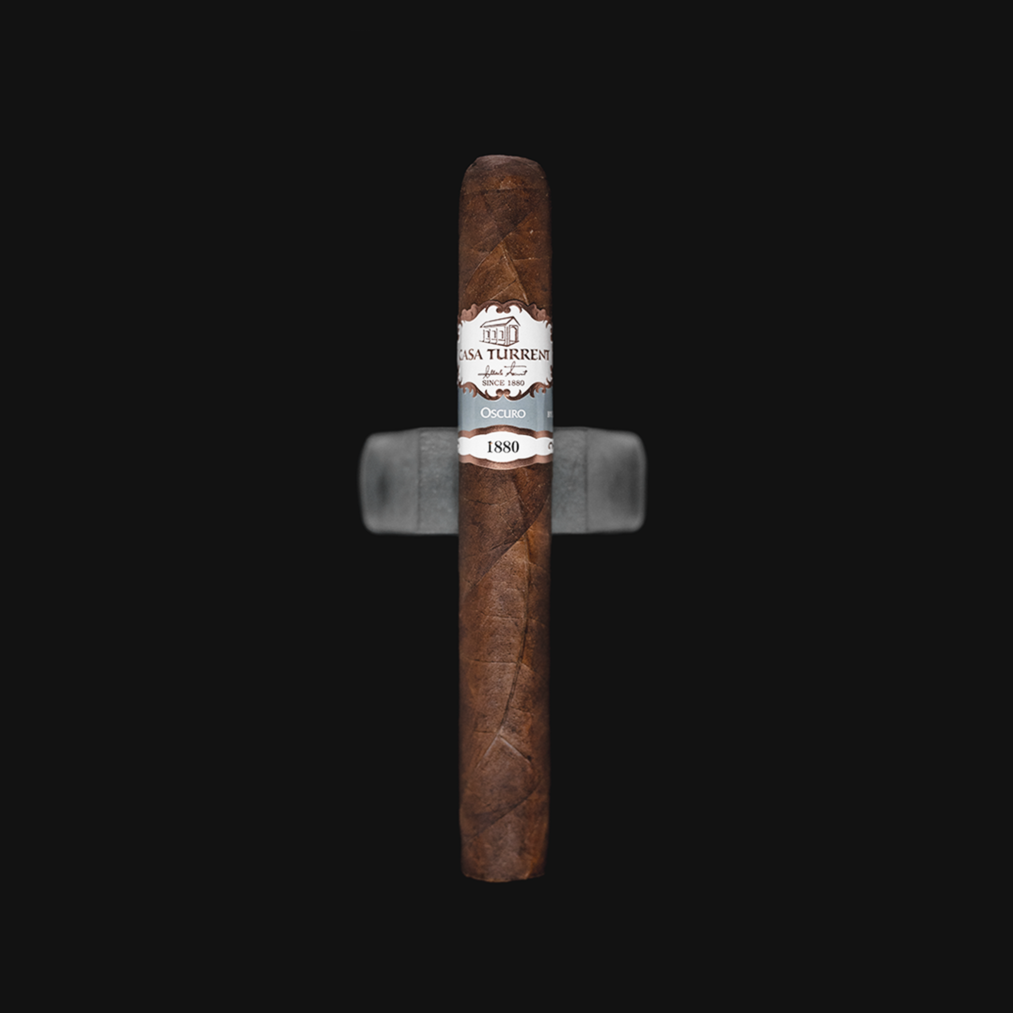 Casa Turrent 1880 Oscuro Double Robusto cigar, featuring a dark Oscuro wrapper and an elegant band, presented in a front-facing view.