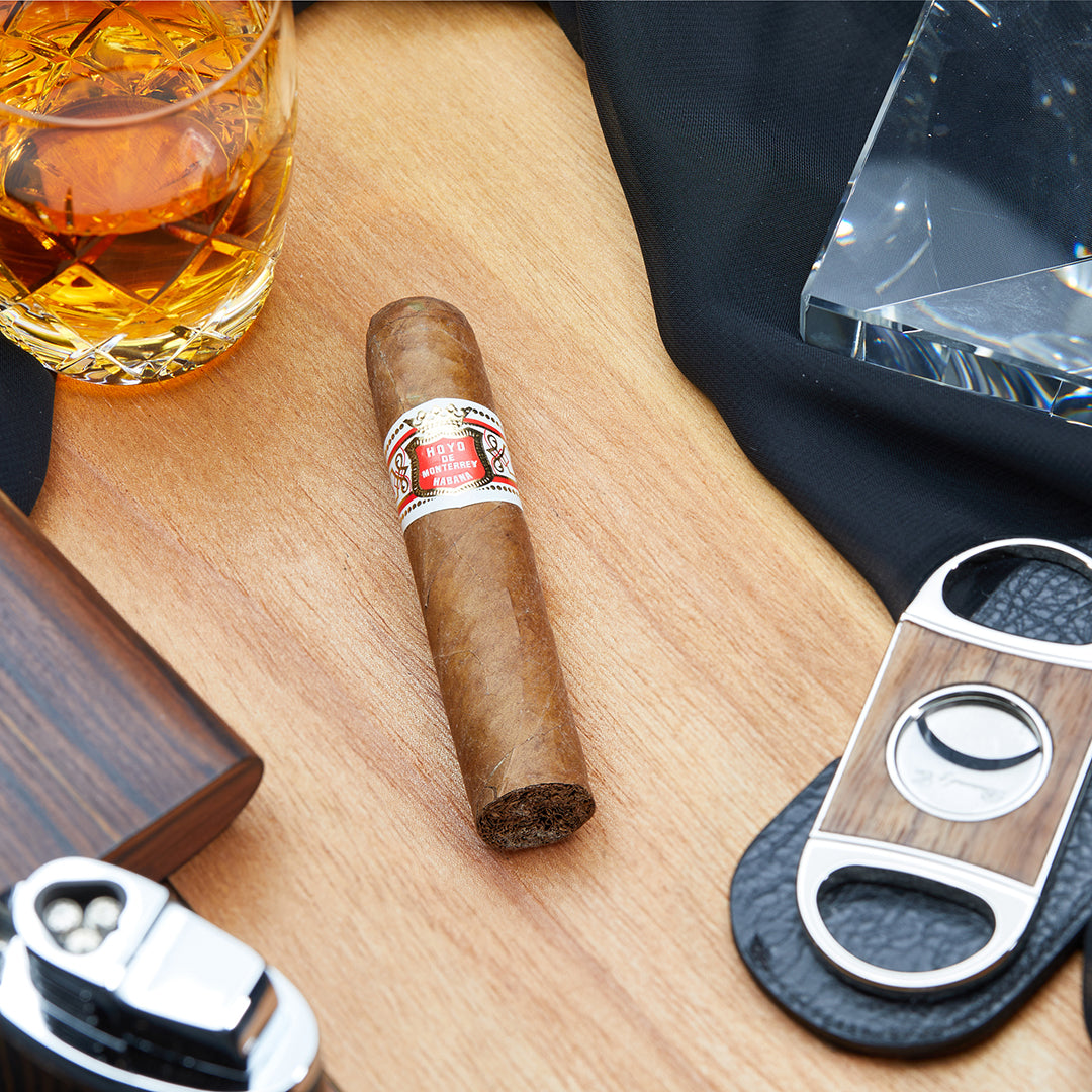 The Hoyo de Monterrey Petit Robusto cigar, presented from the front, displaying its refined branding and classic Cuban appeal.