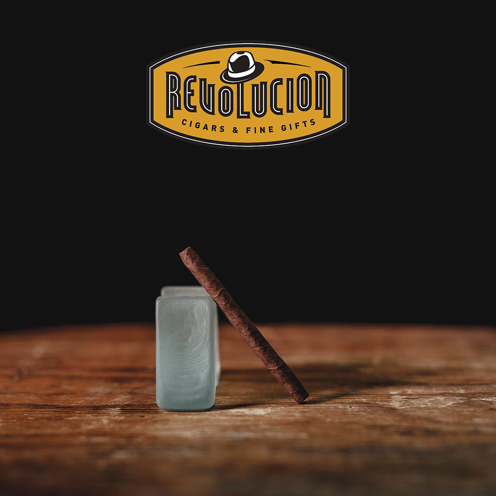 Partagas Mini Full-Strength Cuban Cigarillo box displayed at an angle, showcasing its elegant design and branding.