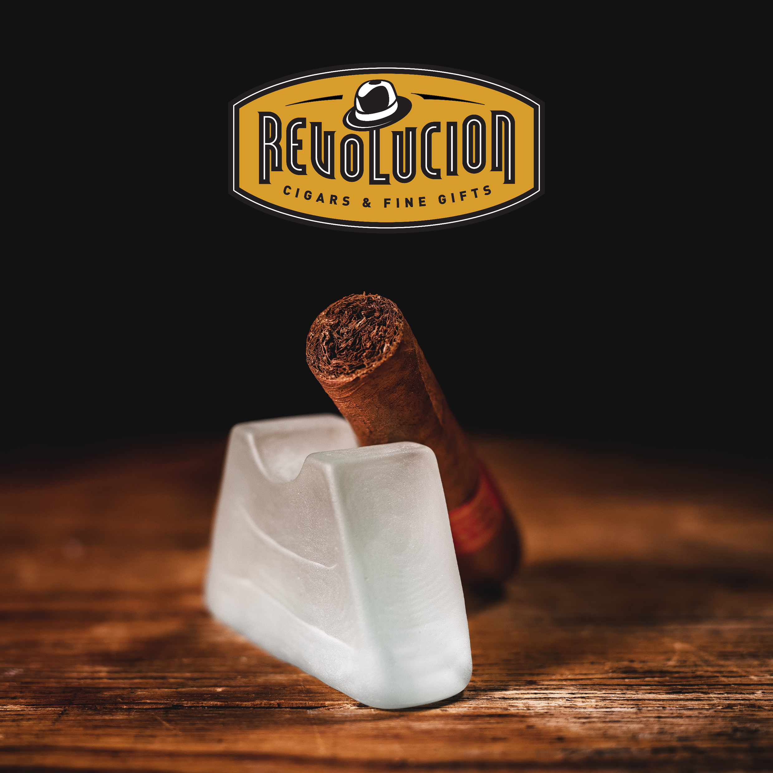 Partagás Serie D No. 6 Cuban cigar with a red band, placed on a Glass object with a dark background.