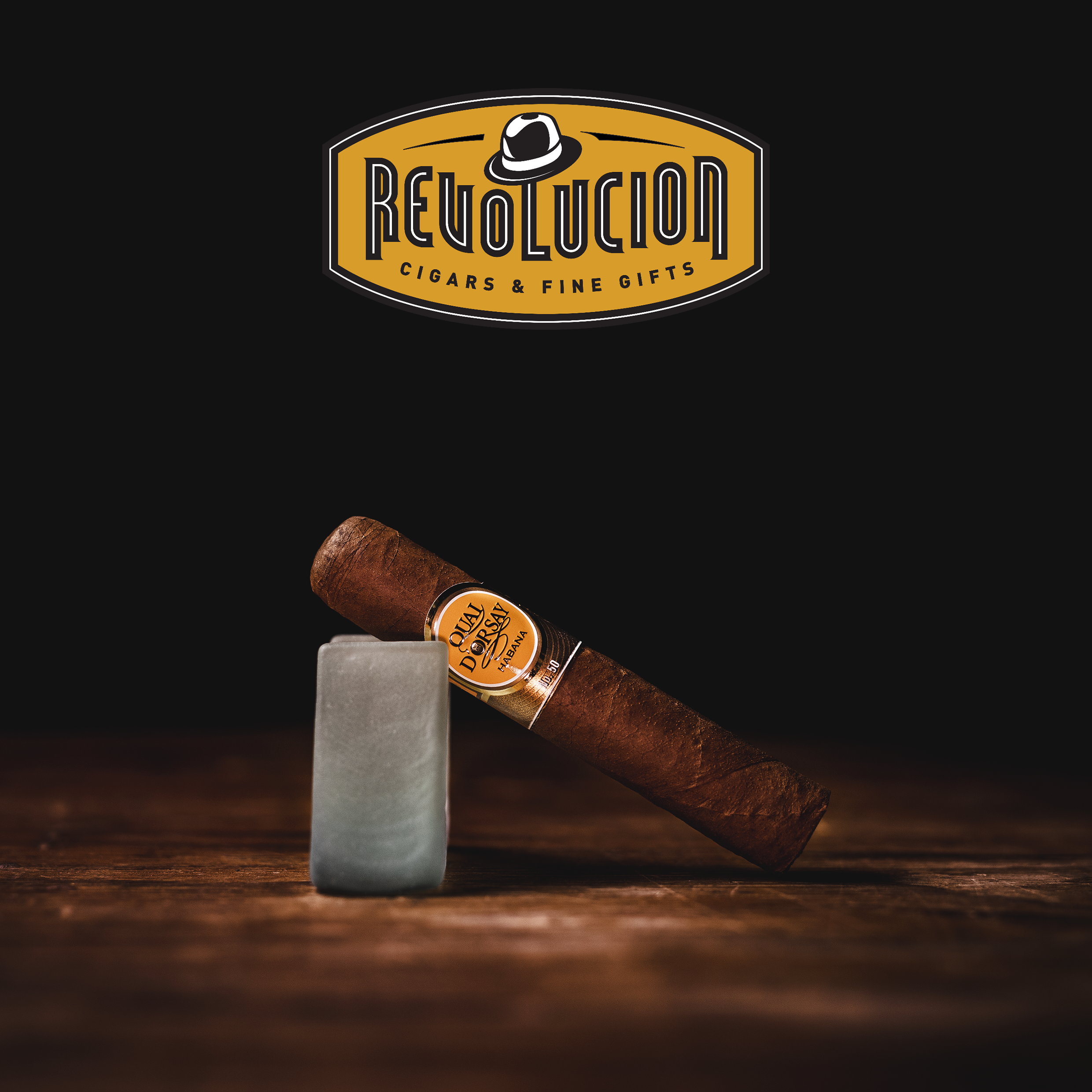 Quai D'Orsay No. 50 Petit Robusto Cuban Cigars displayed at an angle, highlighting the elegant band and smooth, golden-brown wrapper.