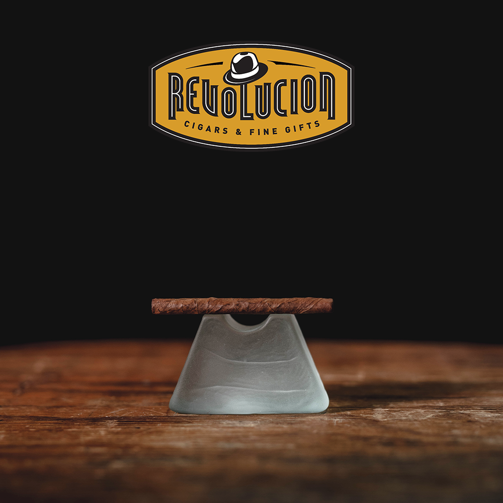 A close-up of the foot of the cigarillo, showing the precise cut and filler tobacco inside.