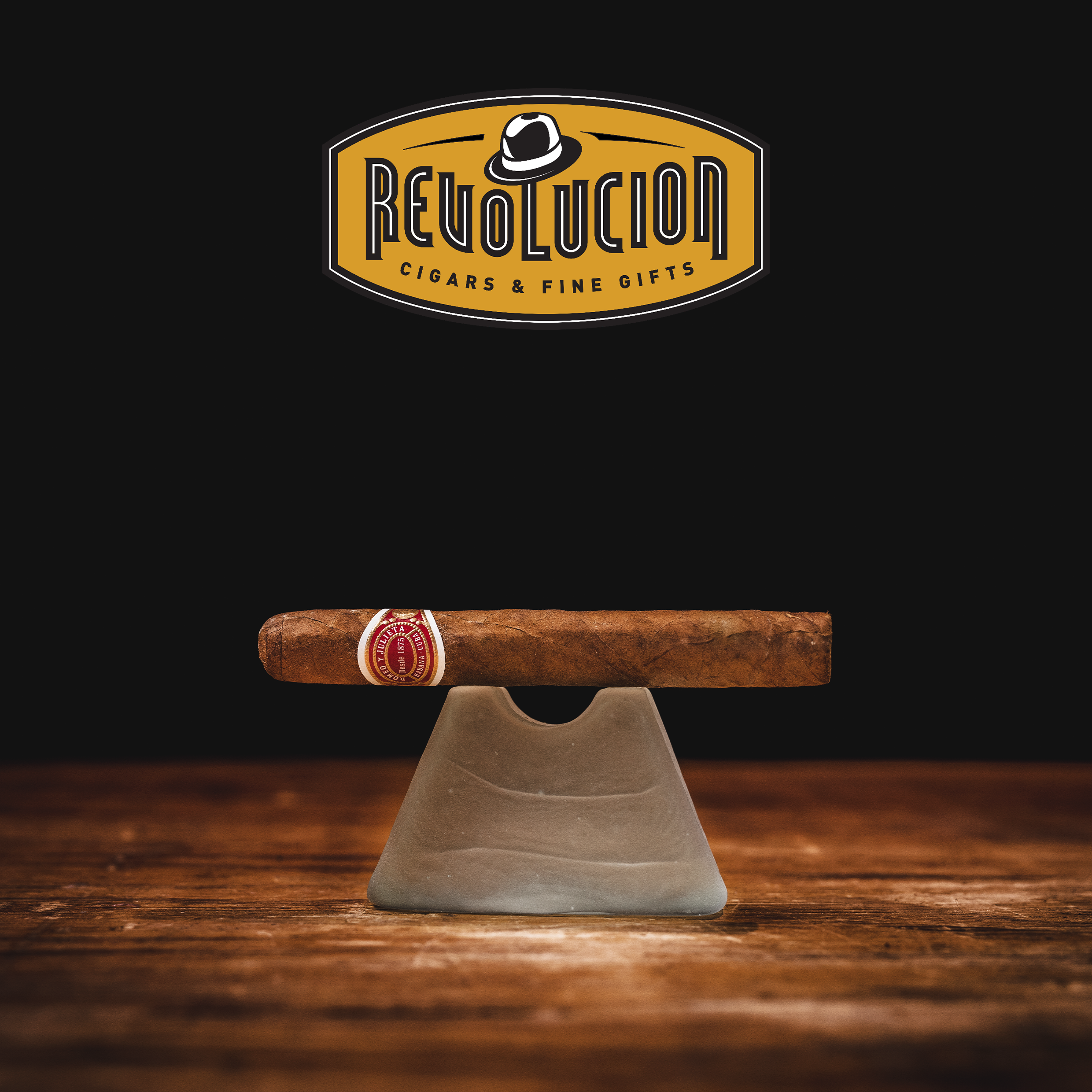 Side view of Romeo y Julieta No.3 Petit Corona Cuban cigar with red and white aluminum tube.