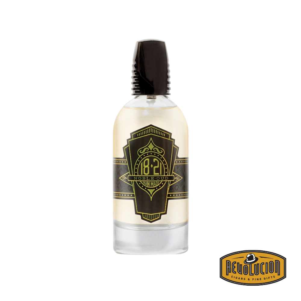 18.21 Man Made Spirits Noble Oud Parfum Spray bottle alongside its stylishly crafted box, exuding sophistication and luxury.