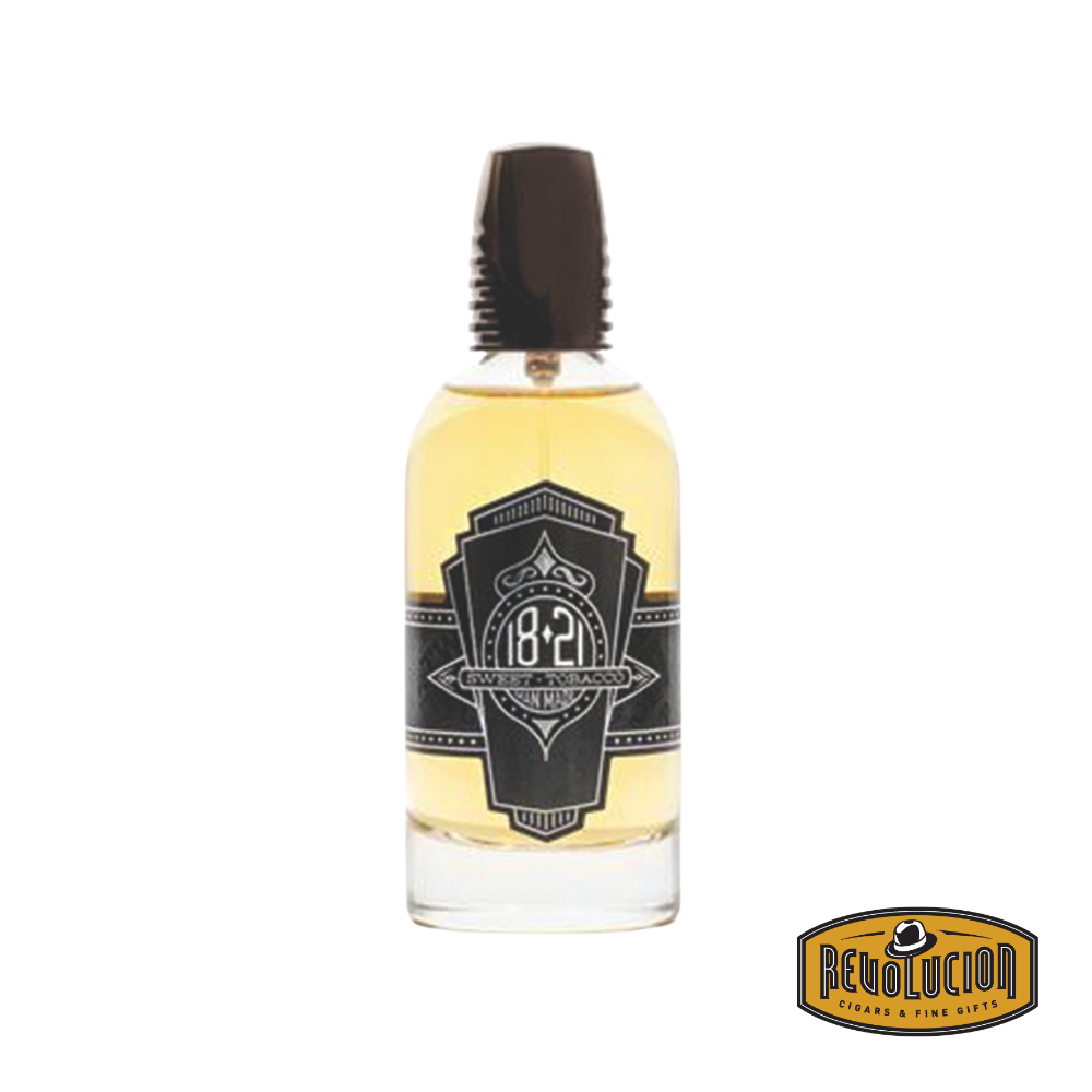 18.21 Man Made Sweet Tobacco Spirits Parfum bottle alongside its elegantly crafted box, embodying classic sophistication.