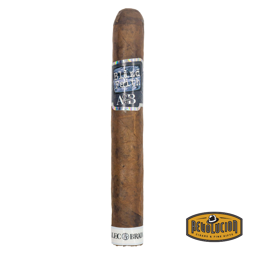 Alec Bradley Blind Faith Toro Medium Strength Honduran Cigar resting on a white background with the Revolucion logo, highlighting its dark wrapper and bold band design.