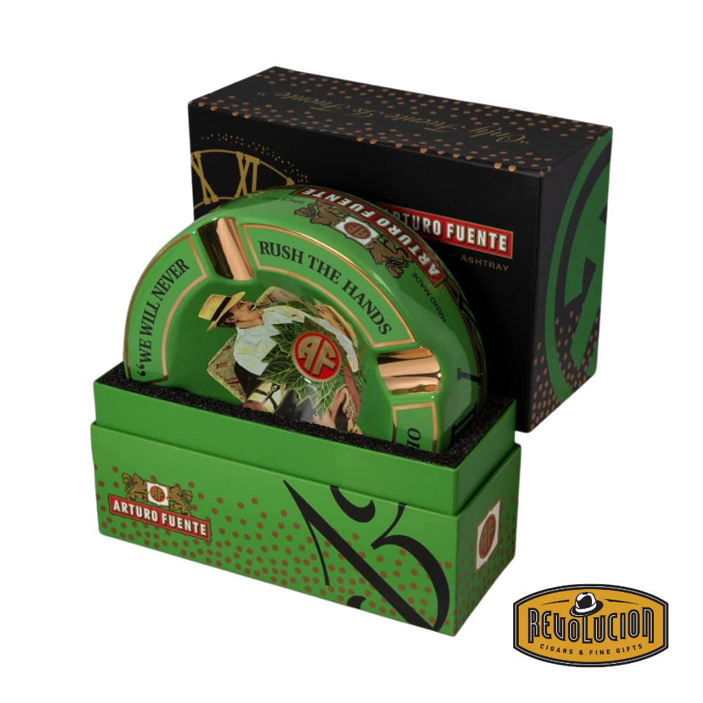 Arturo Fuente &#39;Journey Through Time&#39; Ashtray in Green, elegantly packaged in a branded box, showcasing the iconic Arturo Fuente artwork and gold cigar grooves, displayed with the Revolucion Cigars &amp; Fine Gifts logo.