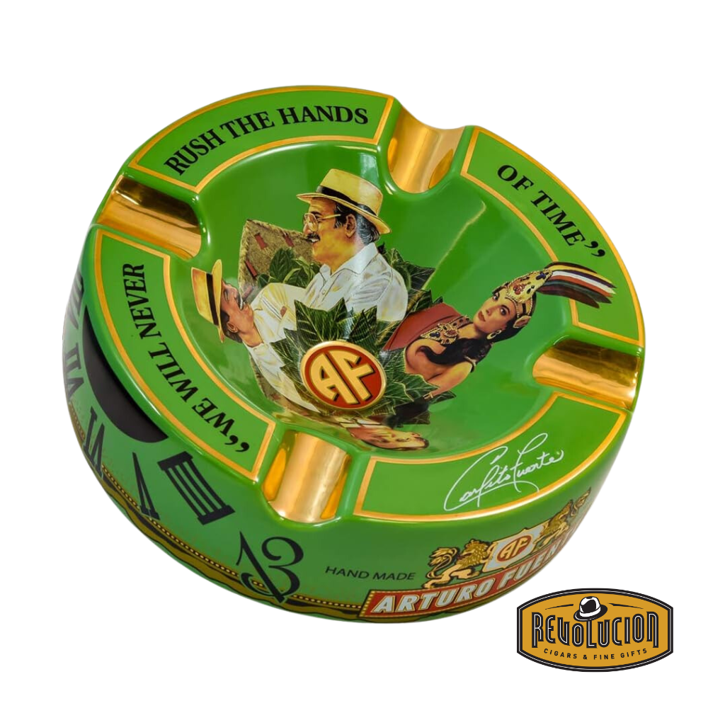 Arturo Fuente 'Journey Through Time' Ashtray in Green, featuring a vibrant design with four gold cigar grooves and iconic Arturo Fuente artwork, displayed with the Revolucion Cigars & Fine Gifts logo.