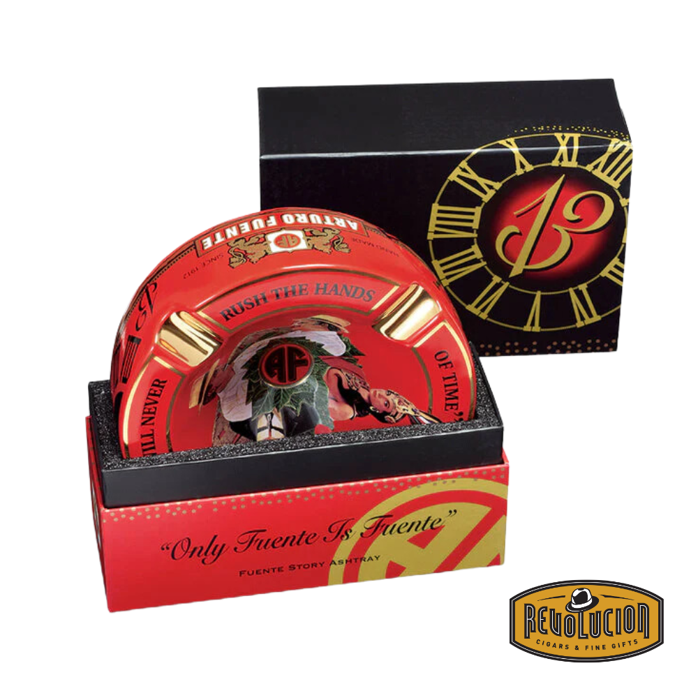 Arturo Fuente &#39;Journey Through Time&#39; Ashtray in Red, elegantly packaged in a branded box, showcasing the iconic Arturo Fuente artwork and gold cigar grooves, displayed with the Revolucion Cigars &amp; Fine Gifts logo.