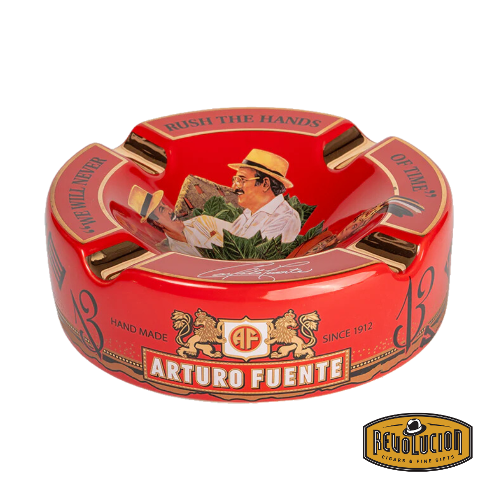 Arturo Fuente 'Journey Through Time' Ashtray in Red, elegantly packaged in a branded box, showcasing the iconic Arturo Fuente artwork and gold cigar grooves, displayed with the Revolucion Cigars & Fine Gifts logo.