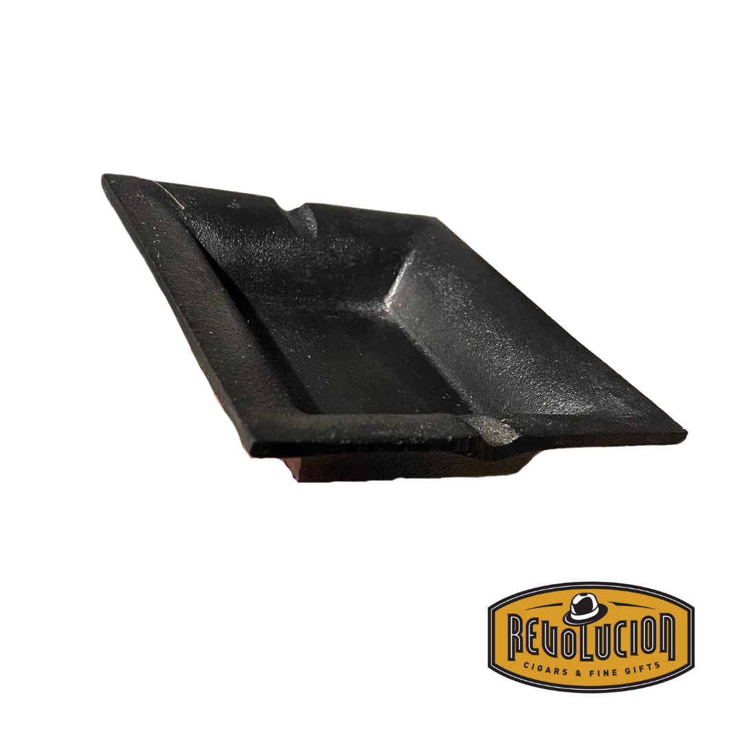 A sturdy cast iron ashtray shown from an angled perspective, highlighting its solid construction and elegant finish.
