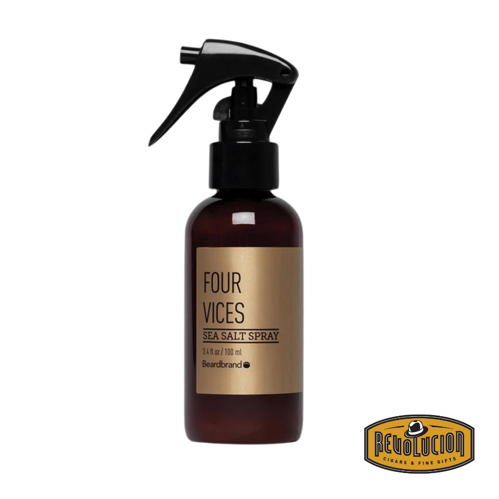 A bottle of Beardbrand Seasalt Spray in the Four Vices scent, crafted to add volume, texture, and a bold aroma to hair and beard.