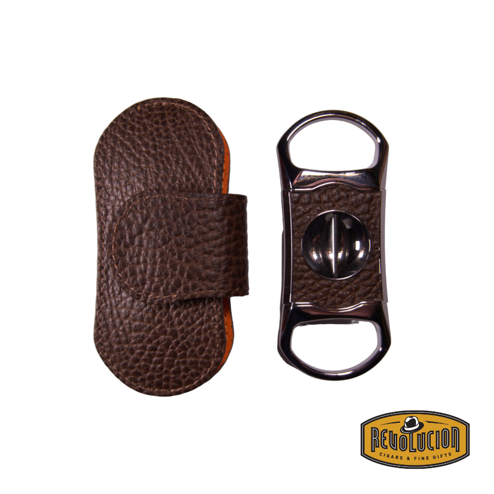 Brizard & Co. "V" Cigar Cutter - Nappa Brown next to its elegant leather case, showcasing a refined leather finish and precision V-cut blade.