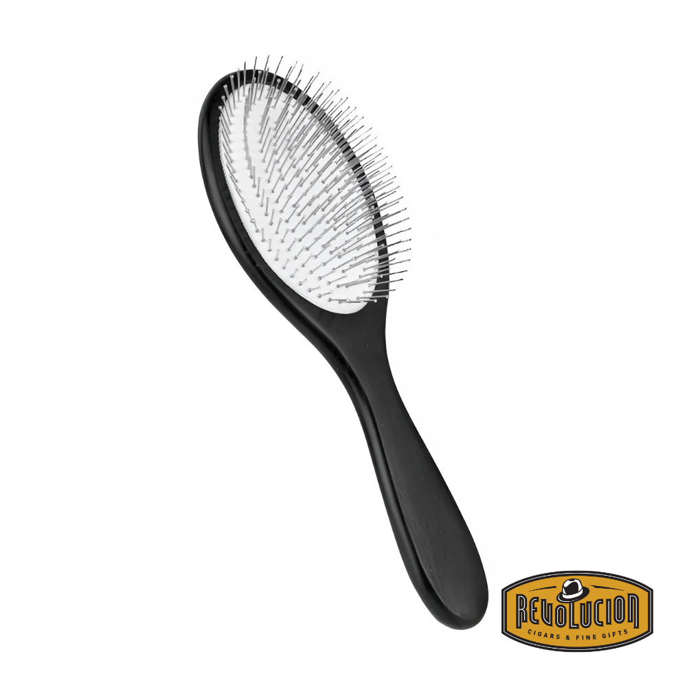Brosse Éminence Metal Brush in a sleek black and white design, featuring a durable metal frame and ergonomic handle for effective hair grooming.