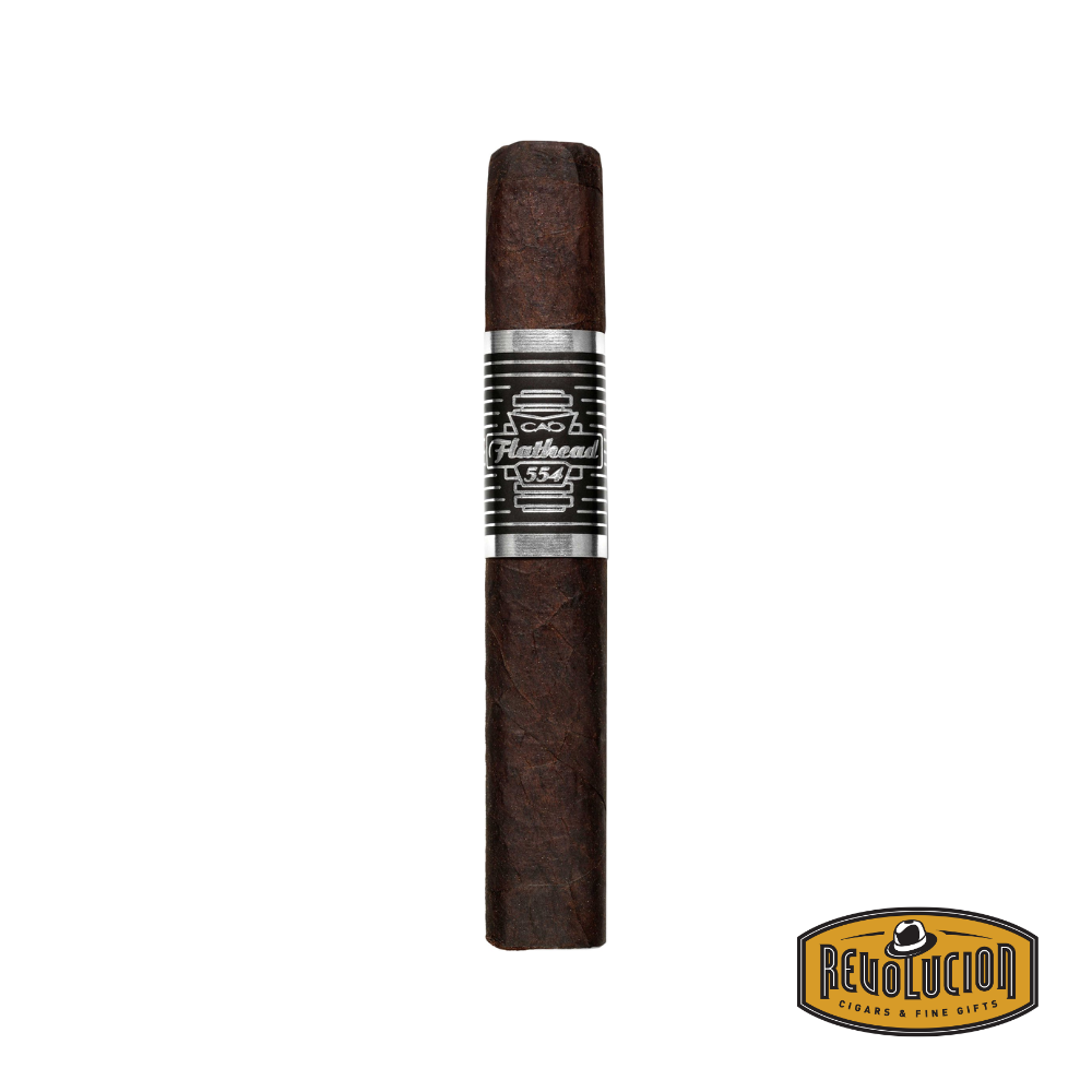 CAO Flathead Camshaft Robusto Maduro Medium-Full Strength Nicaraguan Cigars displayed on a wooden surface with a white background, emphasizing its dark, oily wrapper and bold band design.