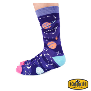 Side view of purple socks featuring colorful celestial graphics, including planets, stars, and constellations. The socks have light purple cuffs, pink toes, and turquoise heels
