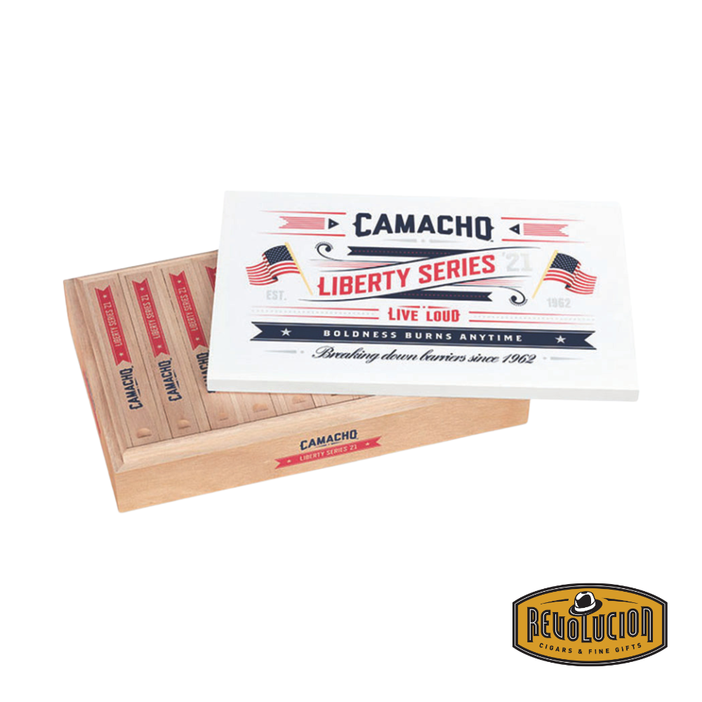 Camacho Liberty 2021 Churchill Medium-Full Strength Honduran Cigar resting on a white background with the Revolucion logo.