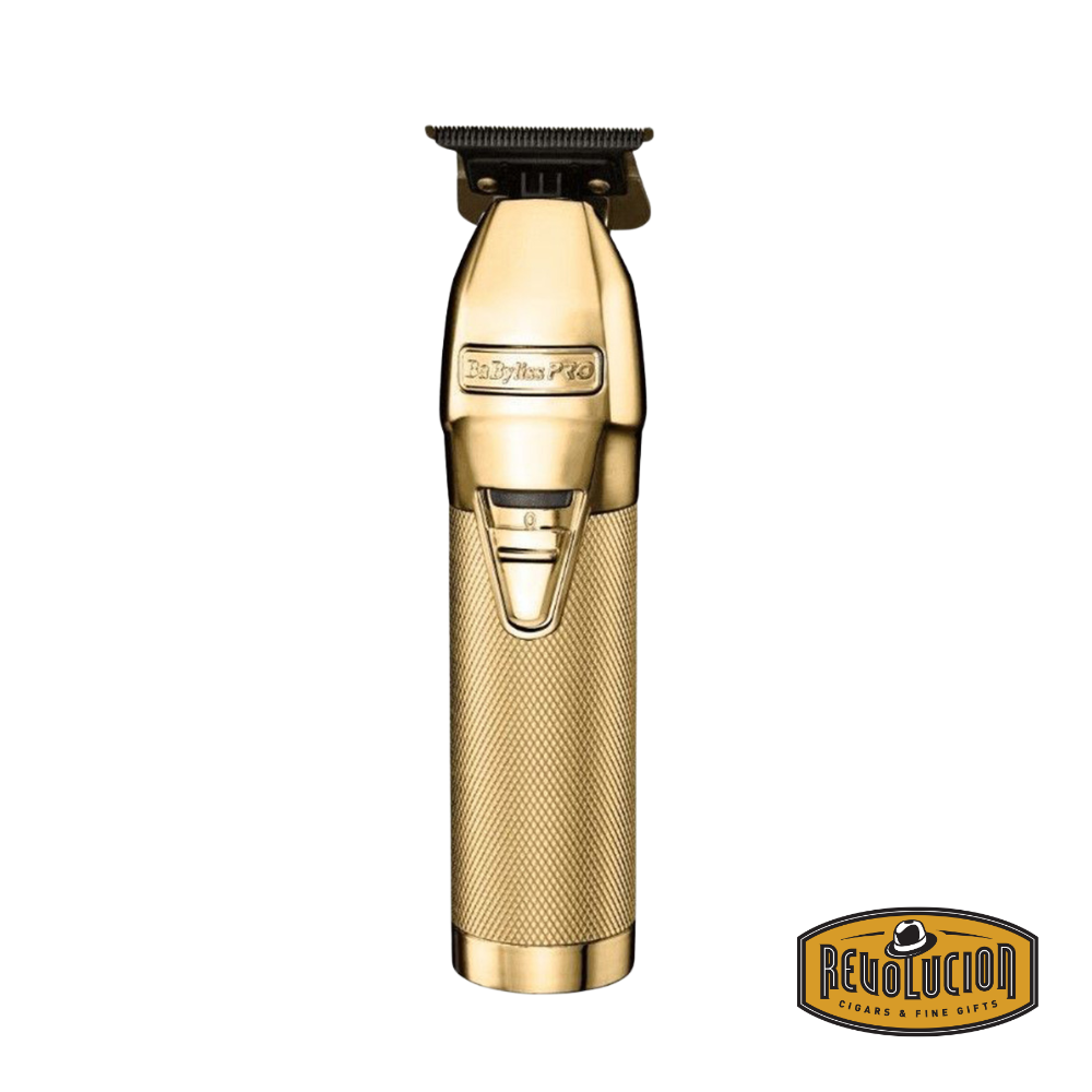 Clipper Babyliss Pro Foil FX Gold on a black display stand, showcasing its sleek gold finish and ergonomic design.