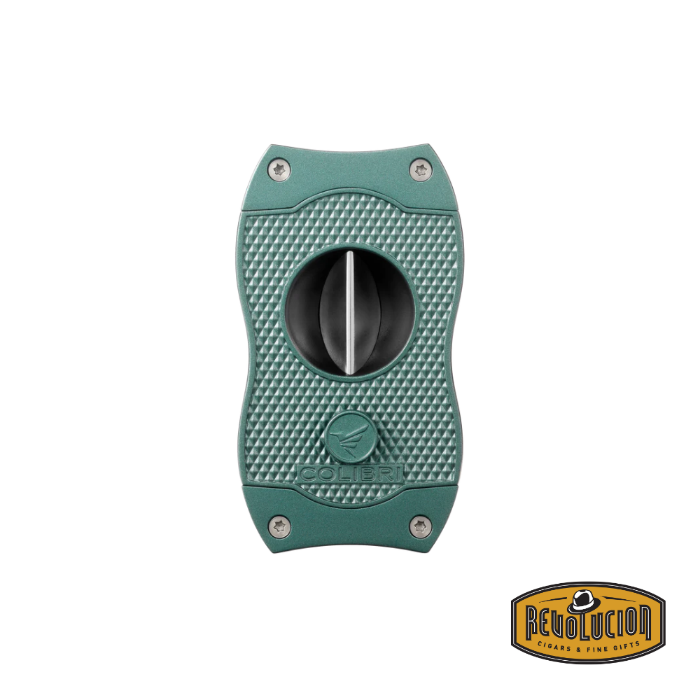 A sleek green Colibri Diamond V-Cut Cigar Cutter featuring a sharp stainless-steel V-shaped blade and a diamond-patterned grip for a secure hold.