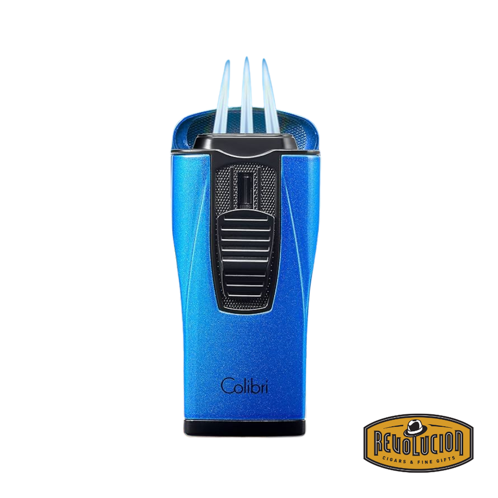 The Colibri Monaco Triple Jet Cigar Lighter in Metallic Blue, ignited with three powerful jet flames for an even burn.