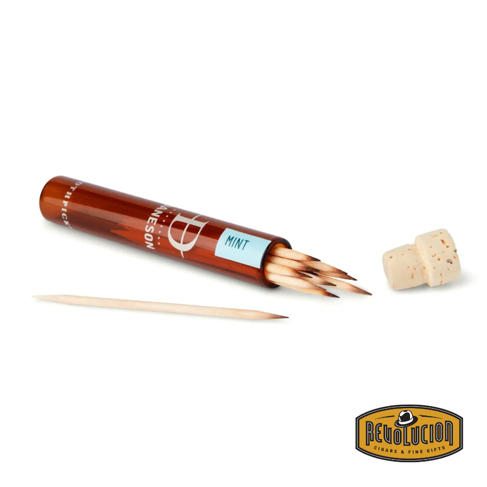 An opened flask of Daneson No.09 Mint Infused Toothpicks, showcasing finely crafted wooden toothpicks infused with a refreshing mint flavor. The sleek packaging reflects the brand’s commitment to quality and sophistication.