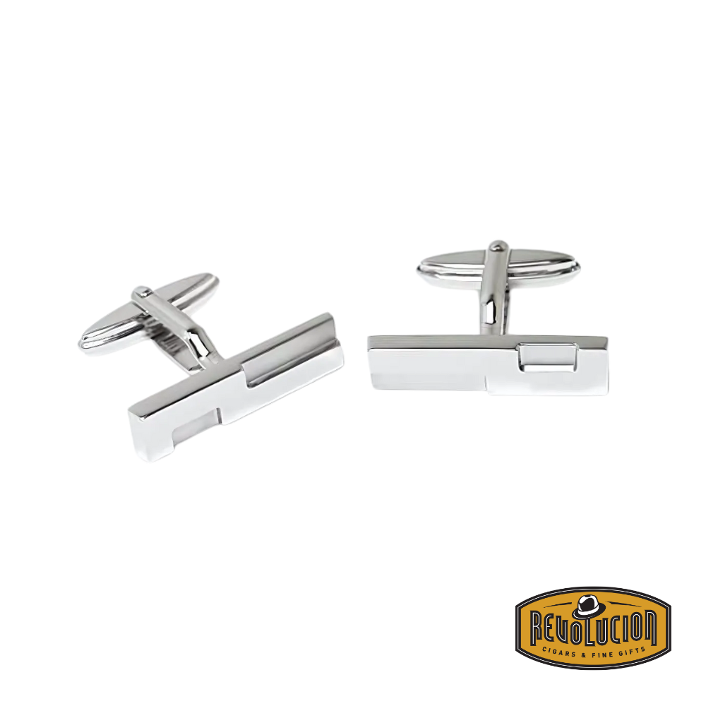 Dunhill cufflinks with a sleek silver finish, featuring a minimalist rectangular design with the brand’s signature “D” logo engraving.