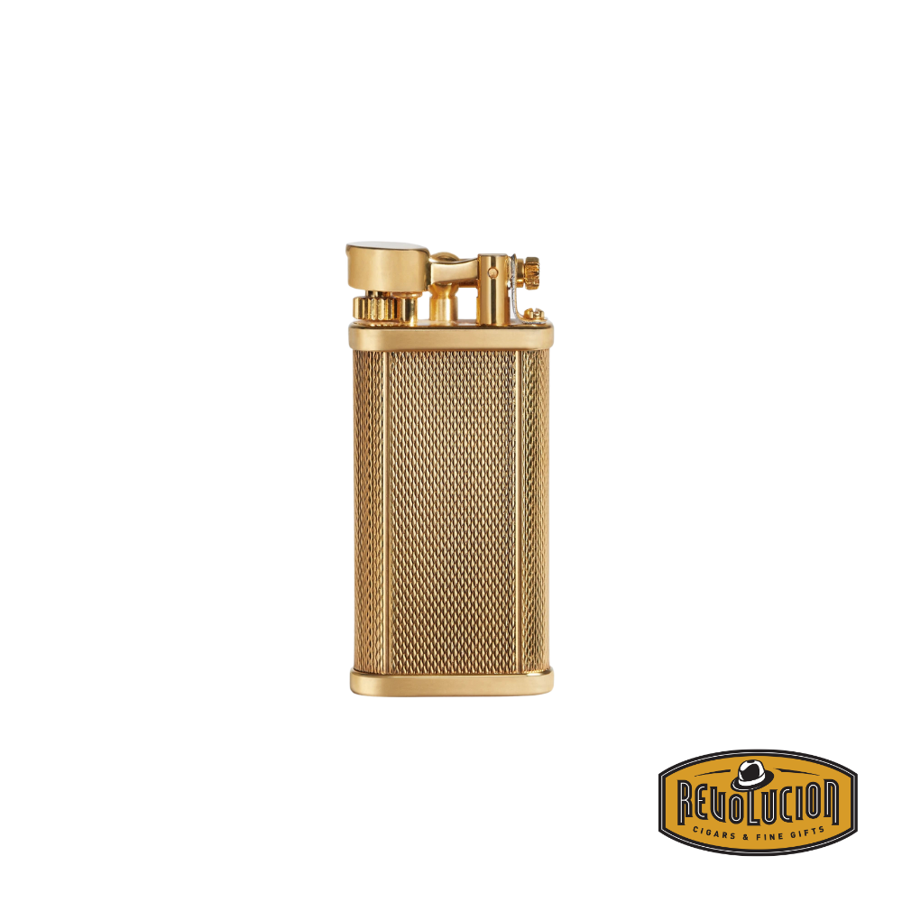 A Dunhill Unique Barley Gold Plate Lighter with an elegant textured barley pattern and luxurious gold-plated finish, featuring the Revolucion logo in the corner.