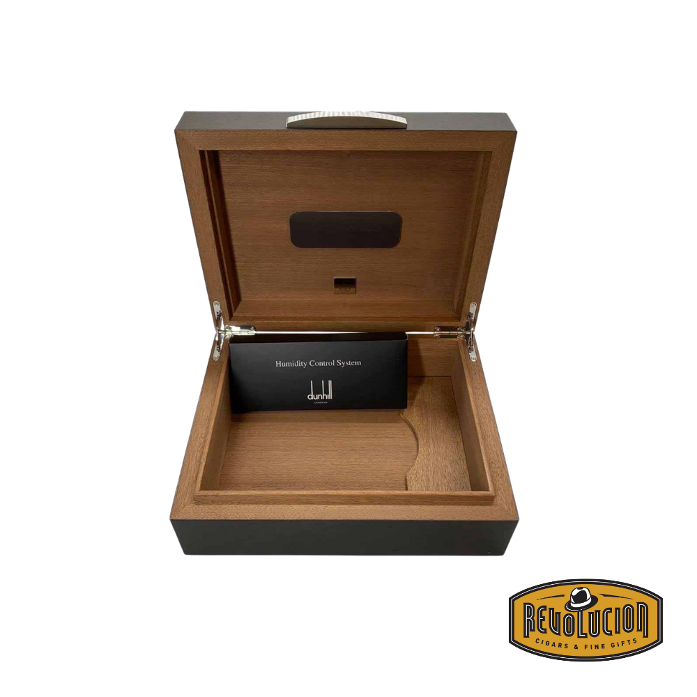 Opened Dunhill White Spot Macassar Ebony Humidor - 50 Count, revealing a spacious interior with a premium humidification system to keep cigars fresh.