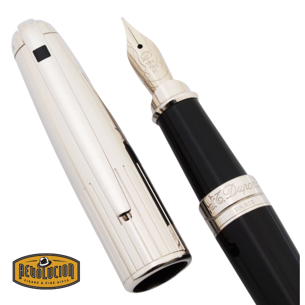 A detailed view of the Dupont Olympio Medium fountain pen, featuring a black lacquer barrel and a palladium-plated cap with fine engravings. The 18K gold nib showcases intricate craftsmanship.