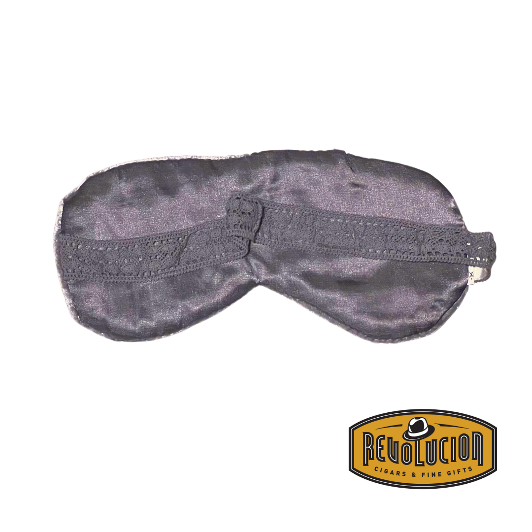 Black and grey sleep mask with a delicate lace-trimmed elastic band, designed for a comfortable and stylish fit.