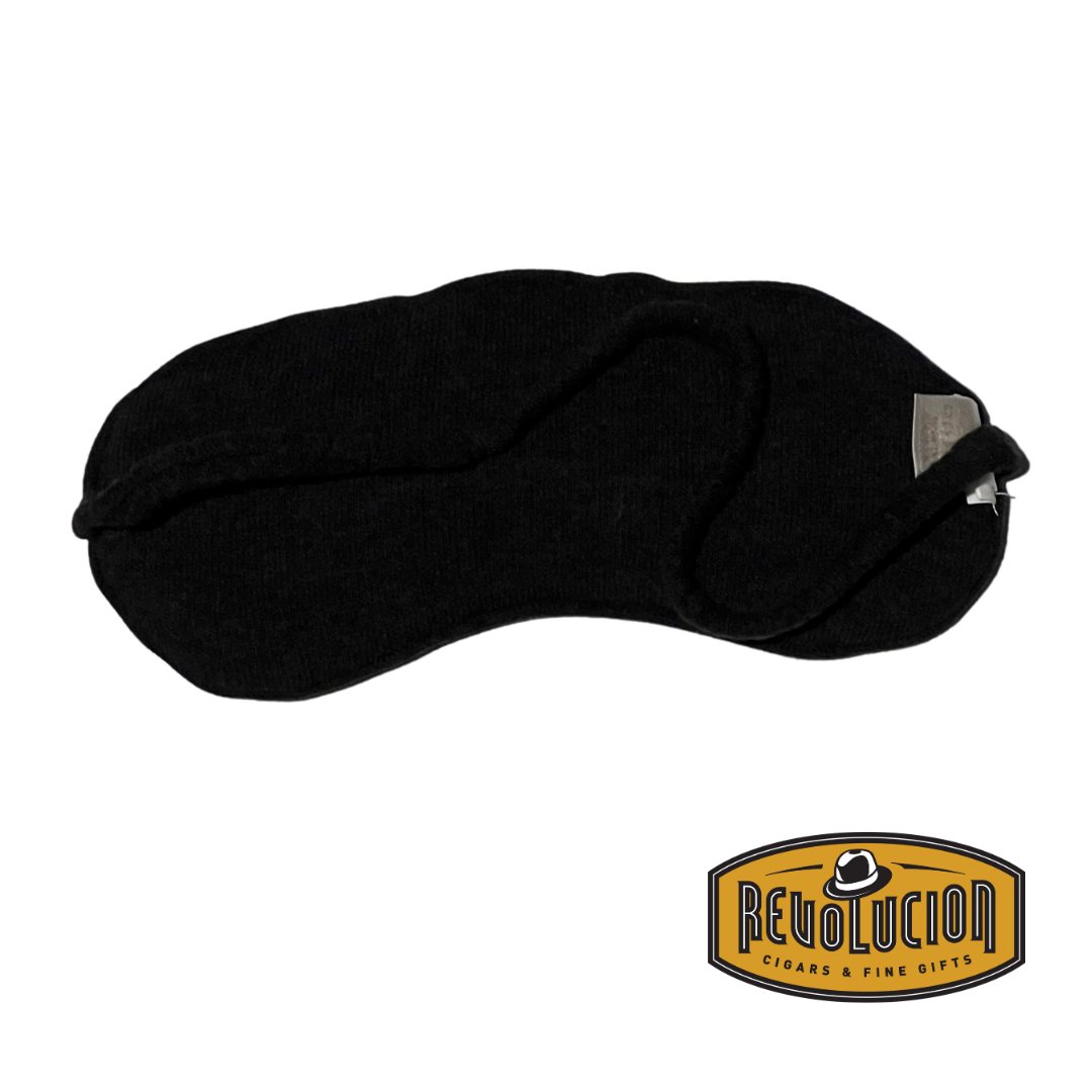 A soft plaid sleep mask with a smooth fabric backing, designed for maximum comfort and an uninterrupted sleep experience.