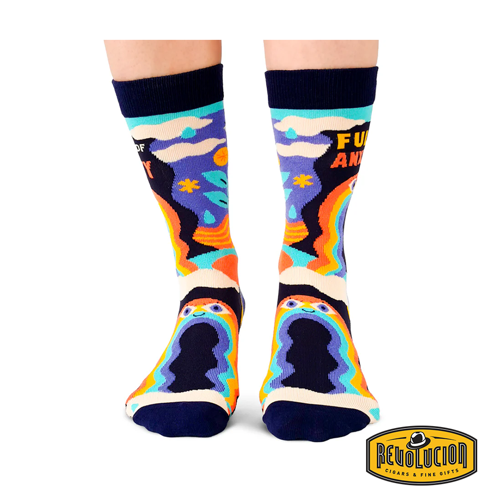 Side view of colorful socks featuring a whimsical design with rainbows, clouds, and a smiling face. The socks display the phrase &#39;Full of Anxiety&#39; and have black cuffs and toes.