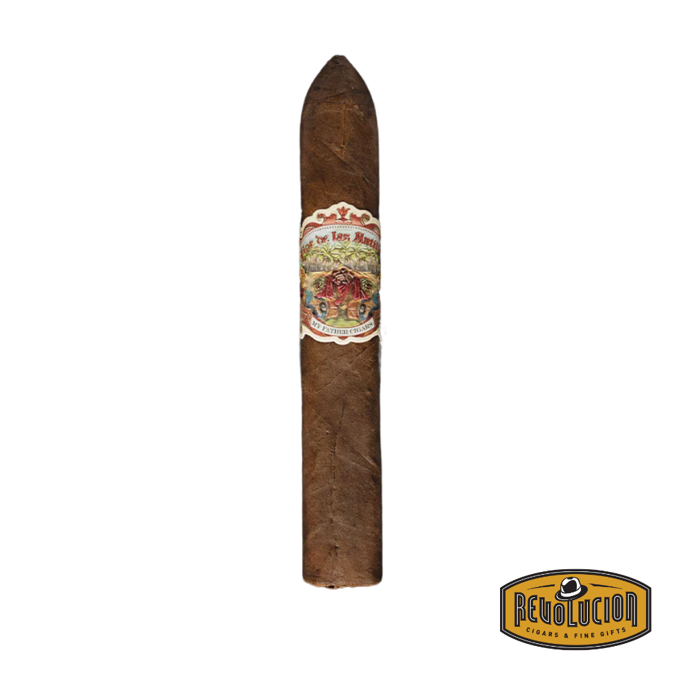 Flor de Las Antillas Belicoso cigar with box-pressed finish and ornate band, resting on a dark wooden surface.