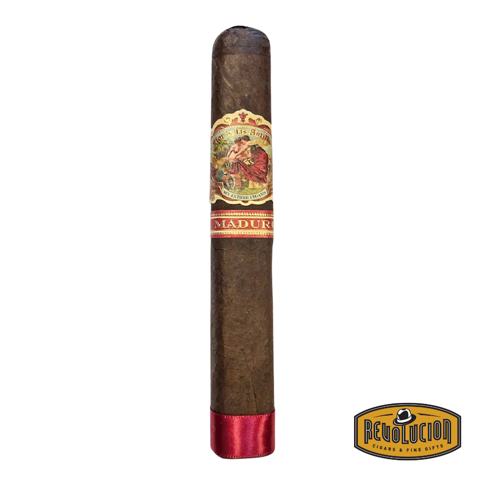 Flor de Las Antillas Toro Maduro cigar with dark wrapper and elegant band, placed on a rustic humidor surface.