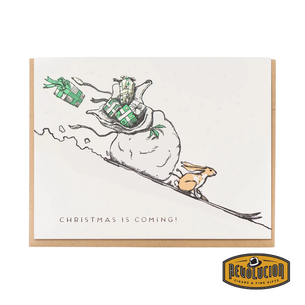 Front of the "Christmas is Coming Rabbit" greeting card, featuring a cute rabbit illustration in a festive winter setting.