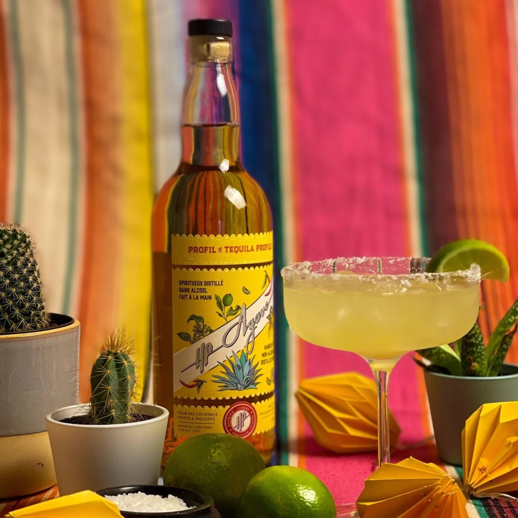 HP Agave Tequila 750 mL bottle served in a glass as an alcohol-free tequila alternative, presented with style.