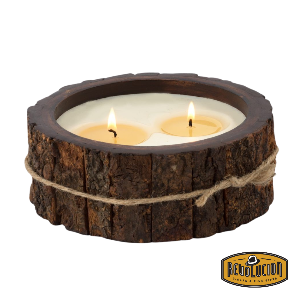 Himalayan Handmade Candles - Medium Tree Bark in Campfire, a lit candle with a rustic, bark-textured exterior.