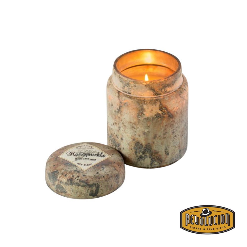 Himalayan Smoke Mountain Fire Glass Lidded Candle – 9oz candle in a sophisticated glass jar, filled with the sweet and floral essence of honeysuckle.