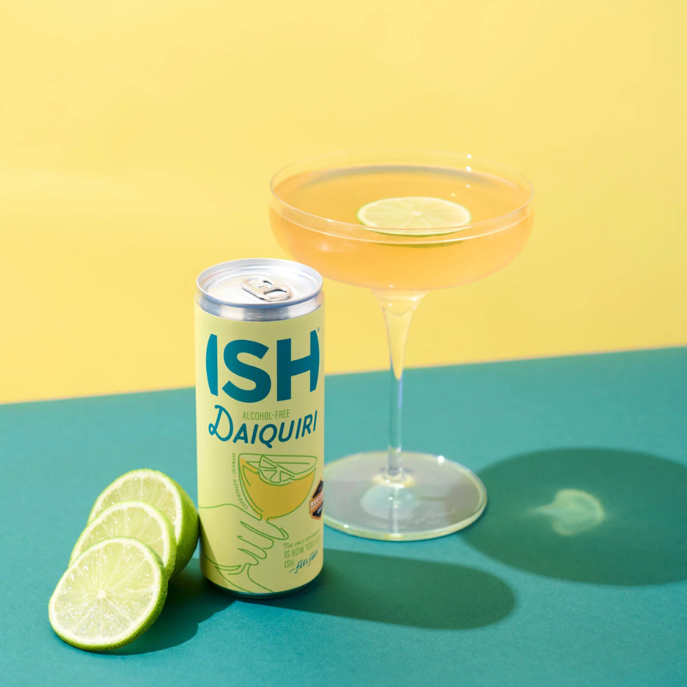A 250 ml can of ISH Lime Daiquiri Non-Alcoholic Cocktail placed next to a glass filled with the tangy, lime-forward mocktail, highlighting its zesty, non-alcoholic refreshment.