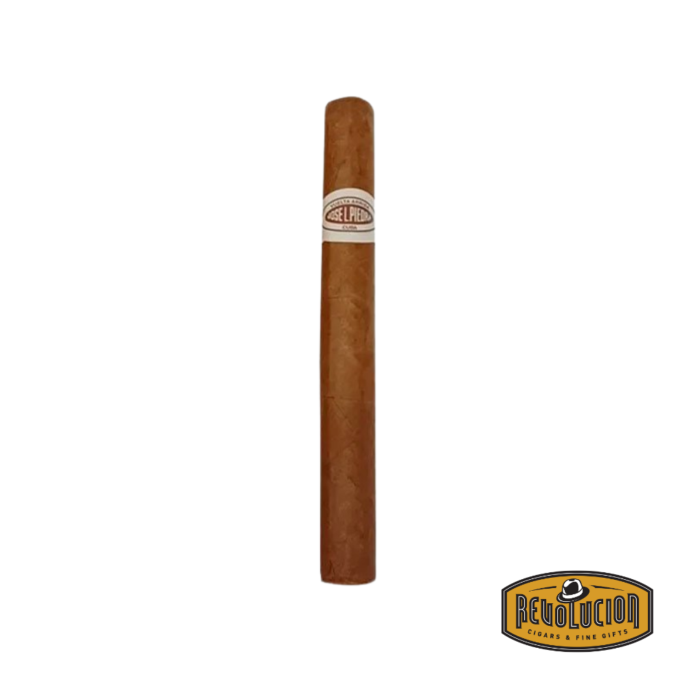 Jose Piedra Cremas Petit Corona Cuban cigar on a white background with the Revolucion logo, featuring a medium-full strength profile and the classic Jose Piedra band.