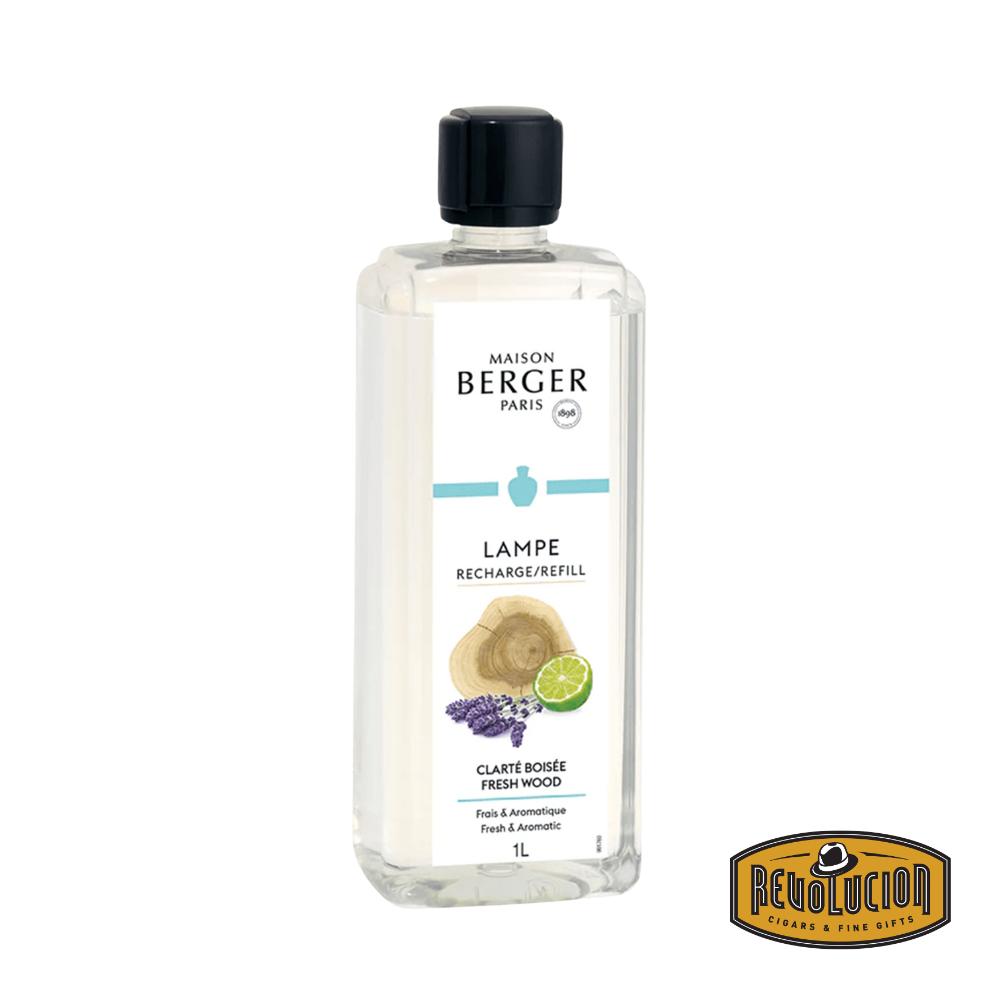 A Lampe Berger Refill bottle in the Fresh Wood fragrance, featuring a sleek and modern design. This premium home fragrance delivers a crisp, woody scent with earthy and refreshing notes, perfect for creating a natural and invigorating ambiance.