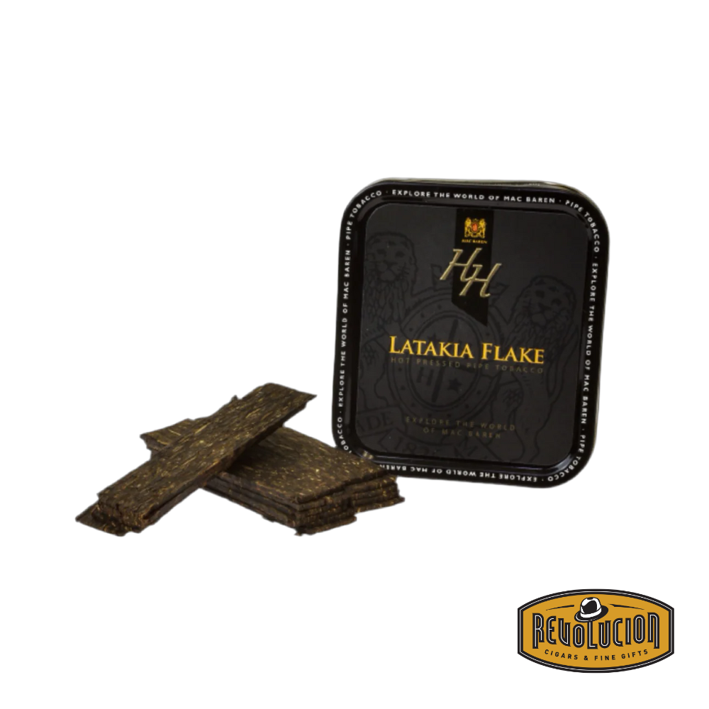 Image of a tin of Mac Baren HH Latakia Flake Pipe Tobacco. The label has a dark and elegant design, highlighting the HH series and Latakia blend. The Revolucion logo is in the corner.