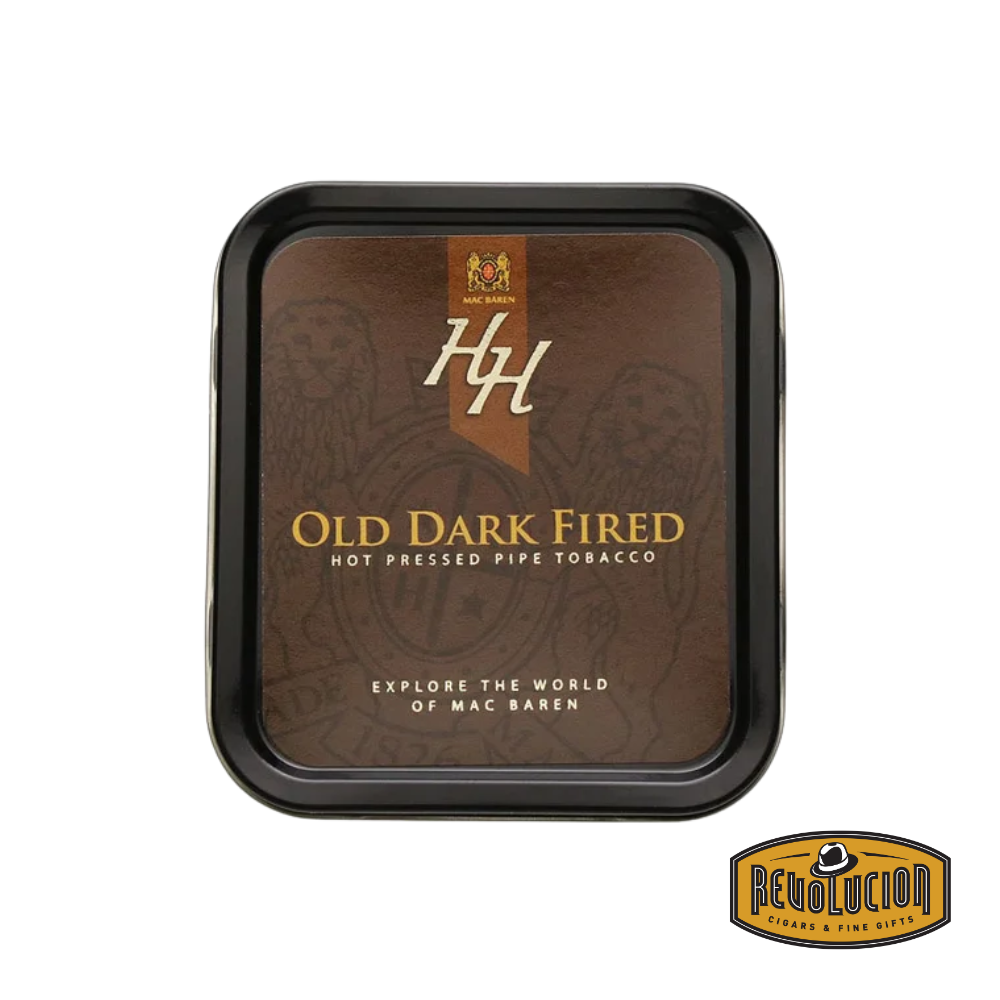 Image of a tin of Mac Baren HH Old Dark Fired Pipe Tobacco. The packaging has a deep, rich design emphasizing the bold, dark-fired tobacco. The Revolucion logo is visible in the corner.