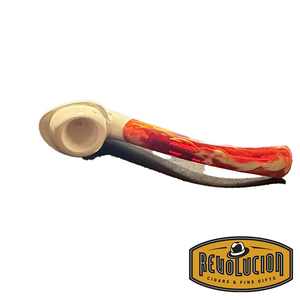 Top view of a Meerschaum pipe featuring a cream-colored bowl with a smooth finish and a vibrant red marbled stem. The pipe is resting on a dark surface.